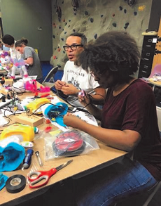 A group of children engaged in crafts at an early learning center.