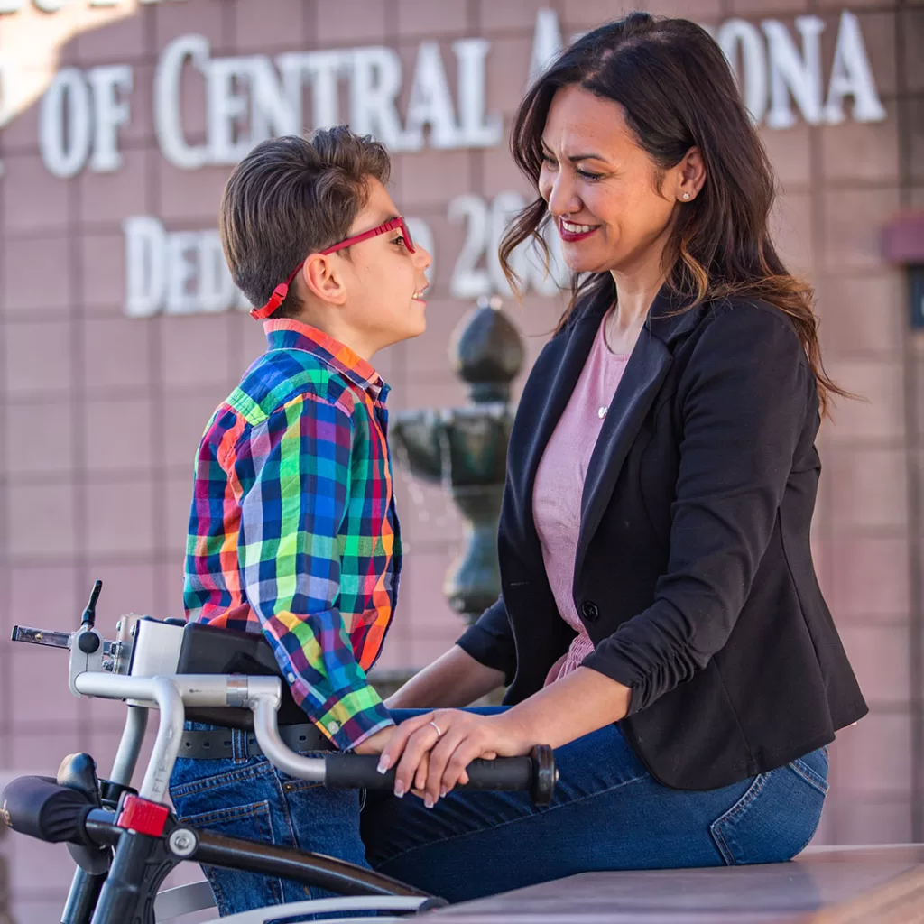 Laura Dozer center united cerebral palsy ambassador with mother