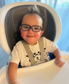 Ace our UCP ambassador getting ready to eat in a high chair