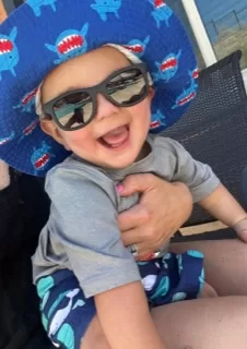Ace smiling in glasses Ace our UCP ambassador enjoying the sun with a shark hat