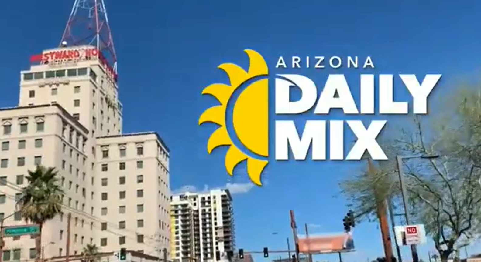 Downtown city buildings under a clear blue sky with the "Arizona Daily Mix" logo and a yellow sun graphic in the foreground.