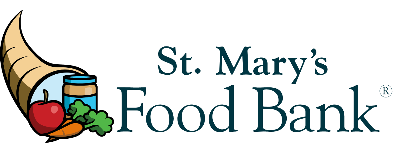 St. Mary’s Food Bank logo with a cornucopia, apple, carrot, leafy greens, and a jar of food next to the organization’s name in blue text.